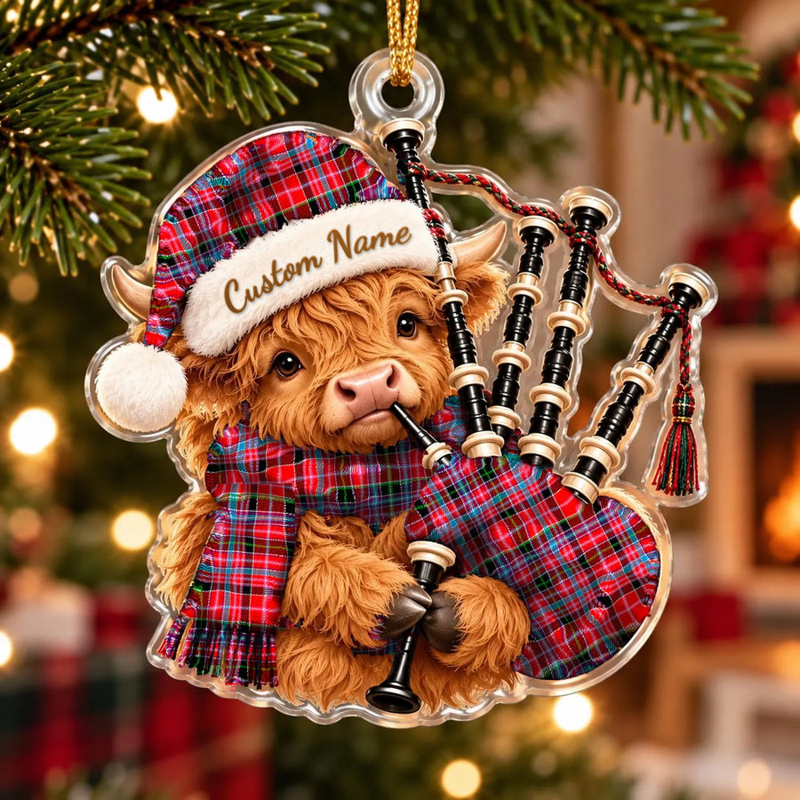 Acrylic Highland cow calf ornament playing the bagpipes, in a Aberdeen District tartan Santa hat, scarf and pipe bag, with a custom name on the hat