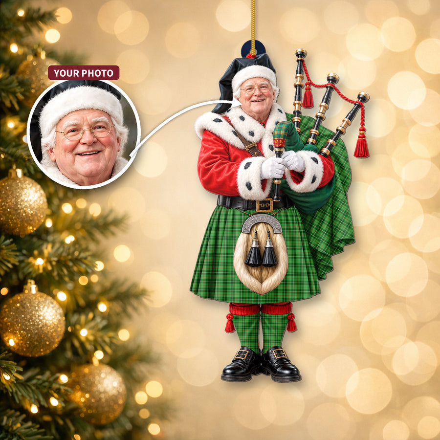 Christmas piper ornament in the Blane 1 tartan hanging on a Christmas tree, with the customer photo used for the face