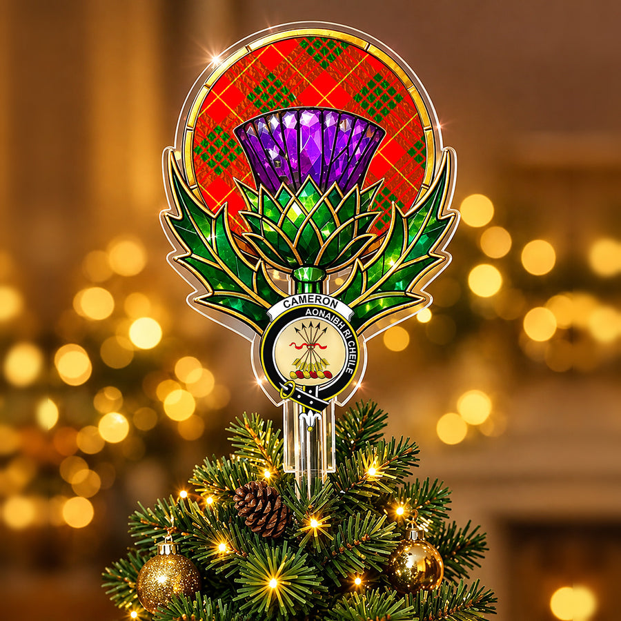 Clan Cameron crest in the centre of a stained-glass style thistle Christmas tree topper with the Cameron Modern tartan behind the thistle