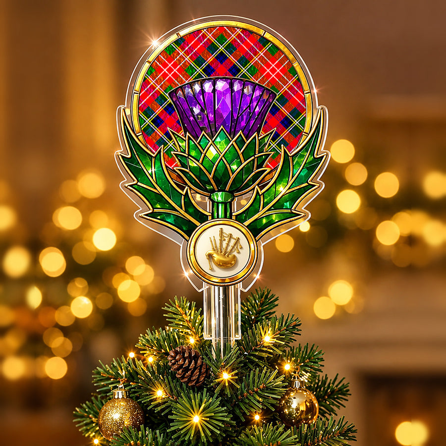 Stained-glass style thistle Christmas tree topper with a gold bagpipe emblem and the Christie tartan behind the thistle