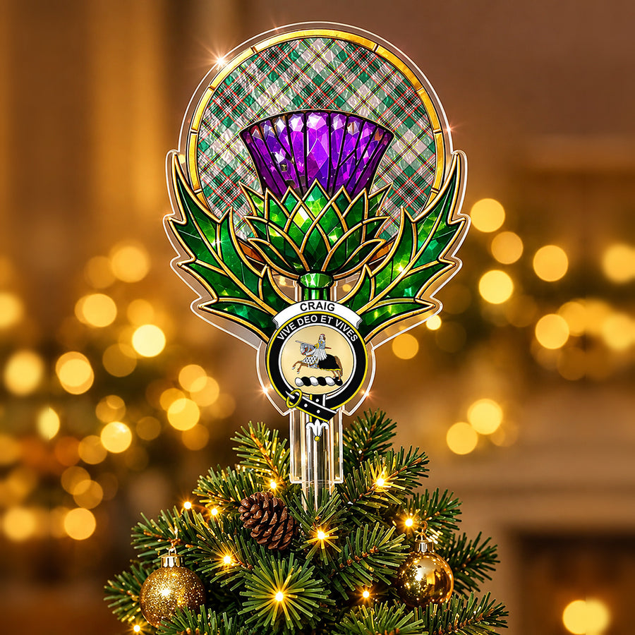 Clan Craig crest in the centre of a stained-glass style thistle Christmas tree topper with the Craig Ancient tartan behind the thistle