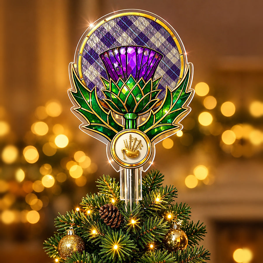 Stained-glass style thistle Christmas tree topper with a gold bagpipe emblem and the Cunningham Dress Blue Dancers tartan behind the thistle