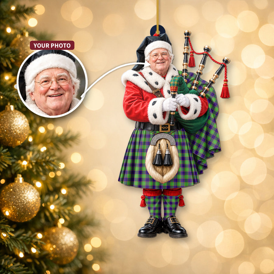 Christmas piper ornament in the Dalrymple tartan hanging on a Christmas tree, with the customer photo used for the face