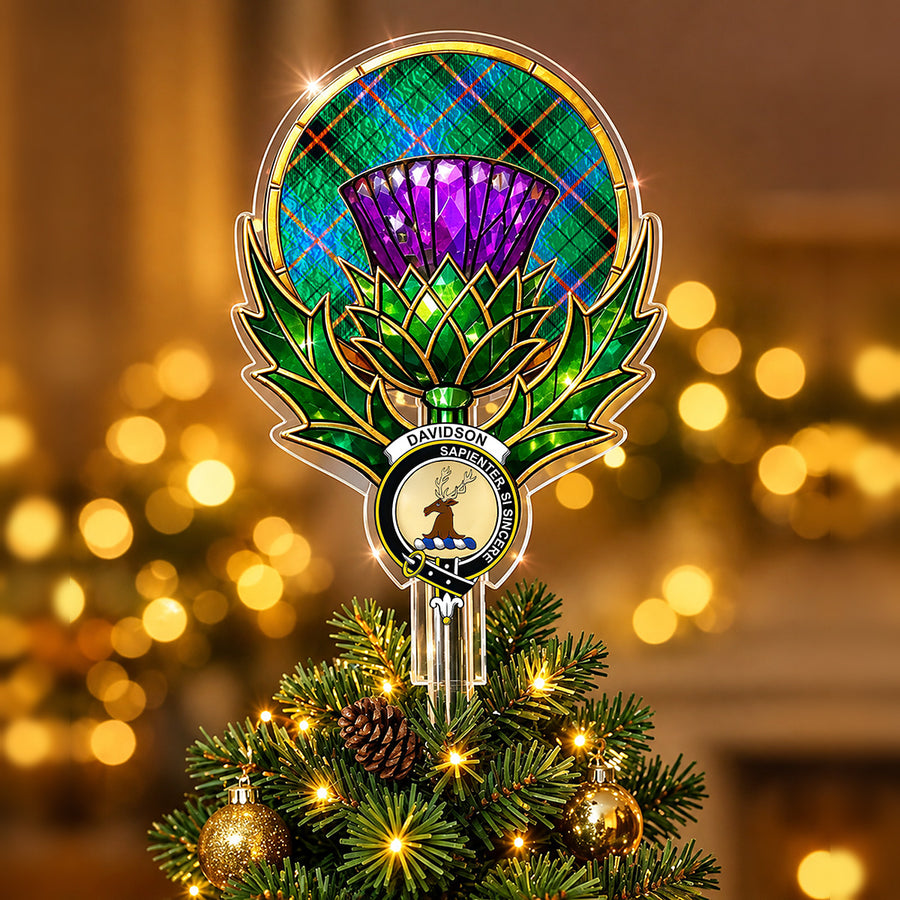 Clan Davidson crest in the centre of a stained-glass style thistle Christmas tree topper with the Davidson Ancient tartan behind the thistle