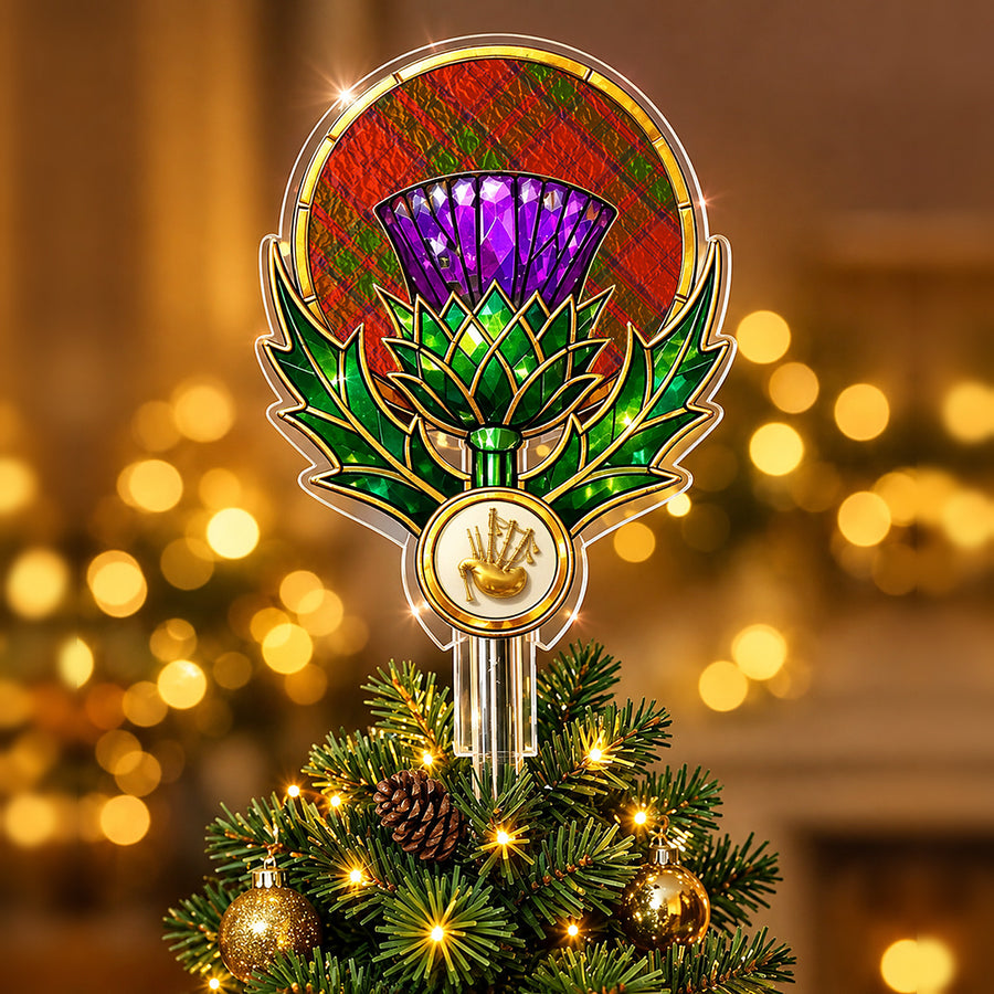 Stained-glass style thistle Christmas tree topper with a gold bagpipe emblem and the Drummond tartan behind the thistle