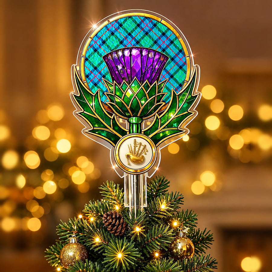 Stained-glass style thistle Christmas tree topper with a gold bagpipe emblem and the Flower Of Scotland tartan behind the thistle