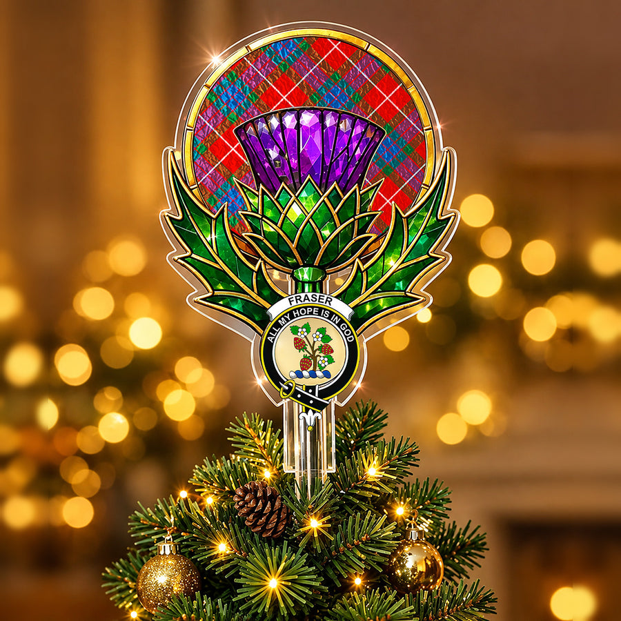 Clan Fraser crest in the centre of a stained-glass style thistle Christmas tree topper with the Fraser Ancient tartan behind the thistle