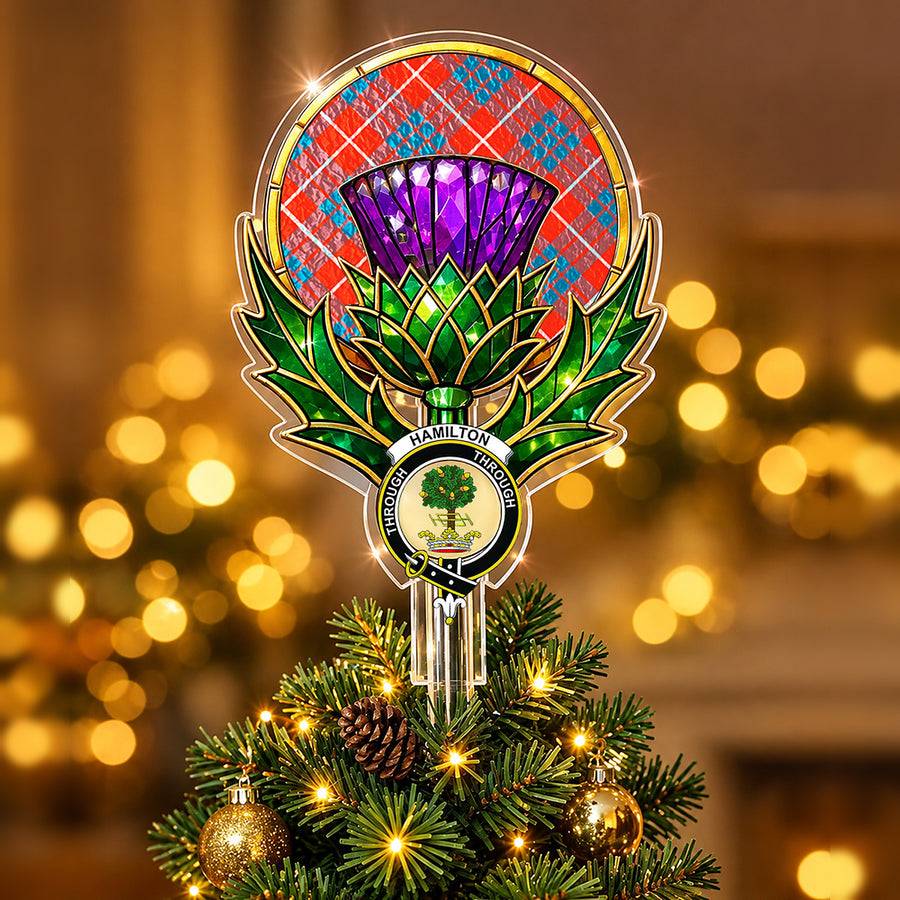 Clan Hamilton crest in the centre of a stained-glass style thistle Christmas tree topper with the Hamilton Ancient tartan behind the thistle