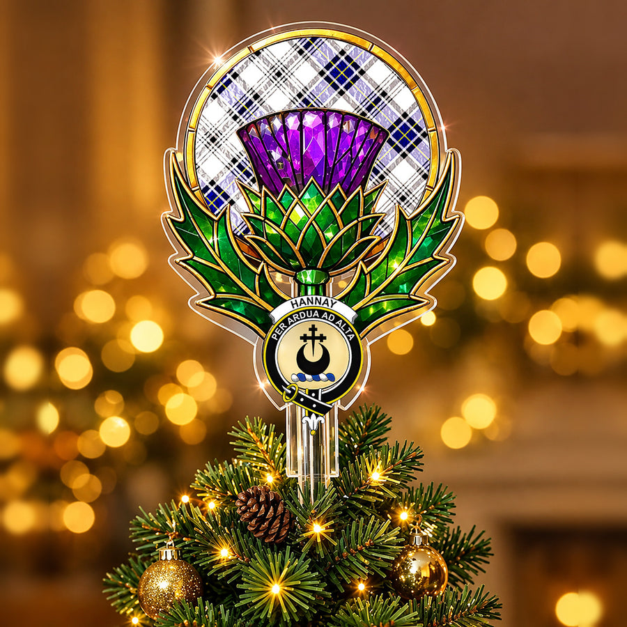Clan Hannay crest in the centre of a stained-glass style thistle Christmas tree topper with the Hannay tartan behind the thistle