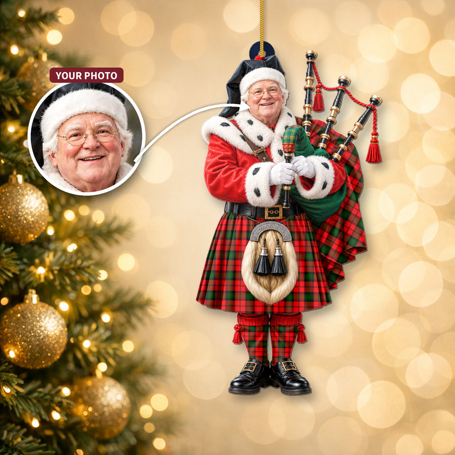 Christmas piper ornament in the Kerr Modern tartan hanging on a Christmas tree, with the customer photo used for the face