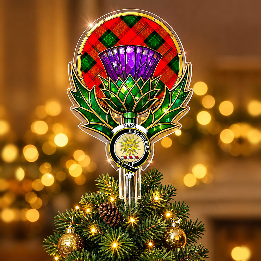 Clan Kerr crest in the centre of a stained-glass style thistle Christmas tree topper with the Kerr Modern tartan behind the thistle