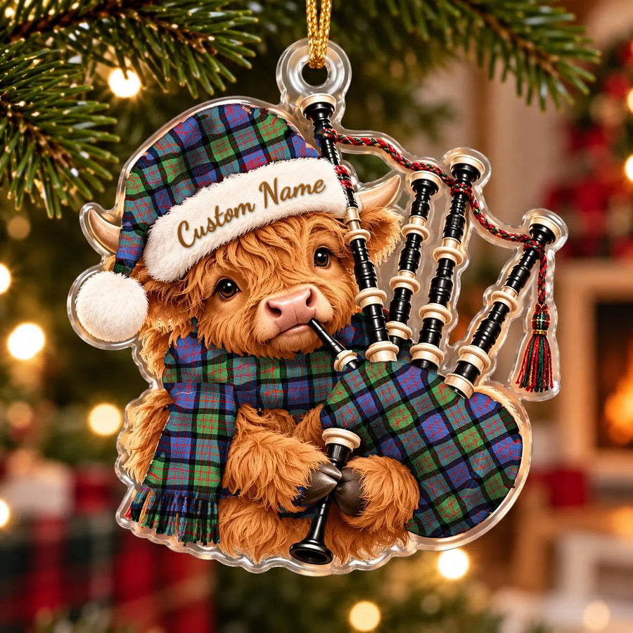 Acrylic Highland cow calf ornament playing the bagpipes, in a MacDonald Ancient tartan Santa hat, scarf and pipe bag, with a custom name on the hat