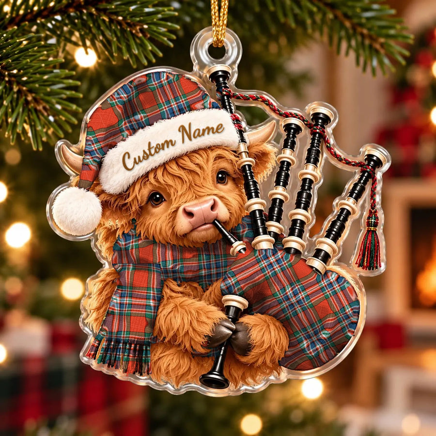 Acrylic Highland cow calf ornament playing the bagpipes, in a MacFarlane Ancient tartan Santa hat, scarf and pipe bag, with a custom name on the hat