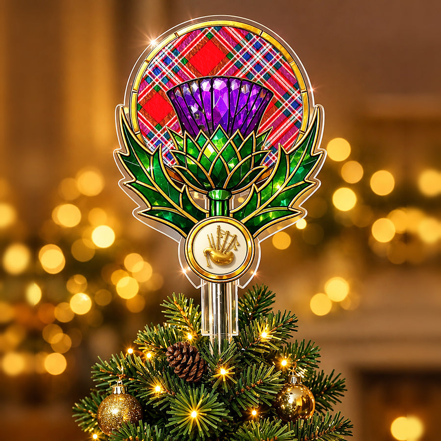 Stained-glass style thistle Christmas tree topper with a gold bagpipe emblem and the MacFarlane Modern tartan behind the thistle