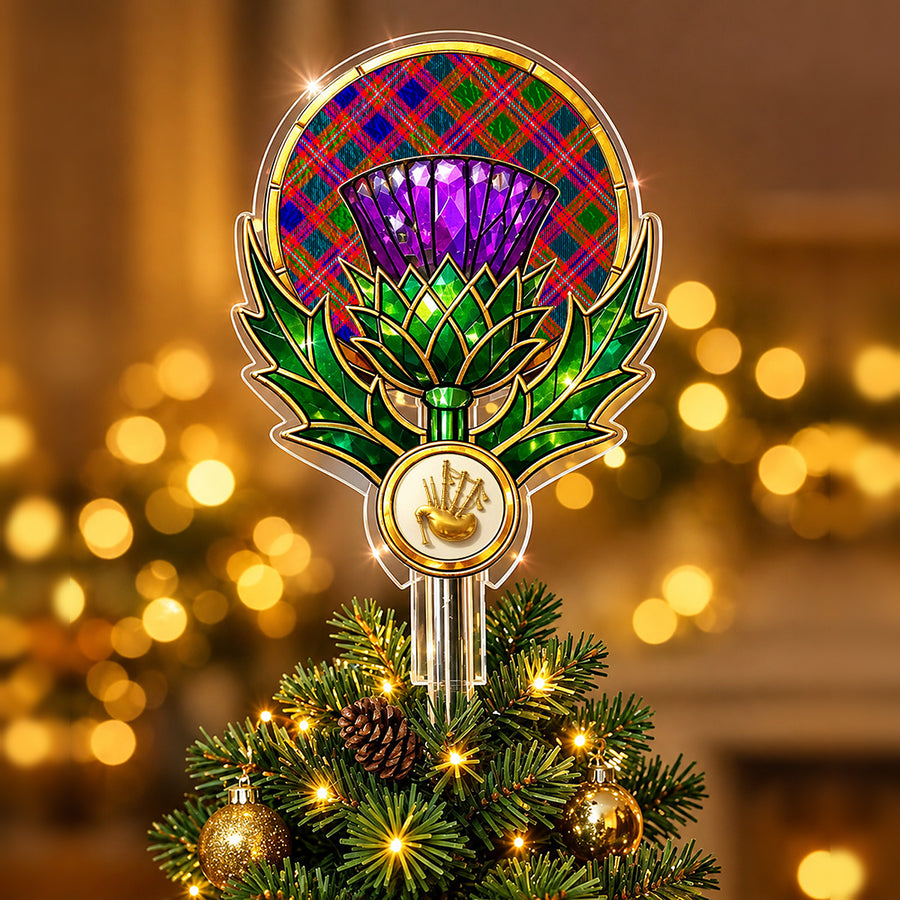 Stained-glass style thistle Christmas tree topper with a gold bagpipe emblem and the MacIntyre Modern tartan behind the thistle