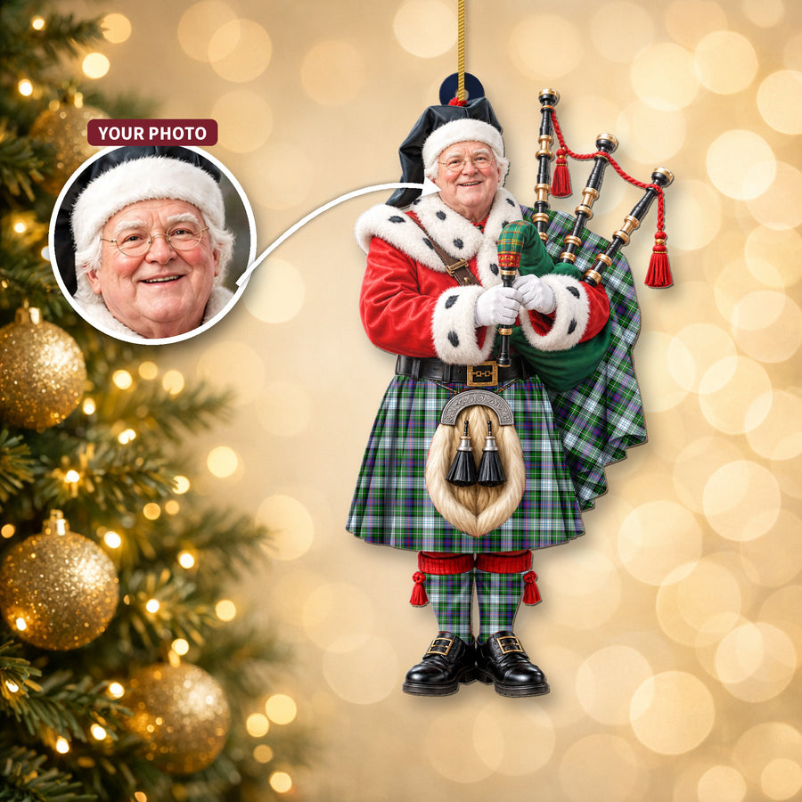 Christmas piper ornament in the MacKenzie Dress Modern tartan hanging on a Christmas tree, with the customer photo used for the face