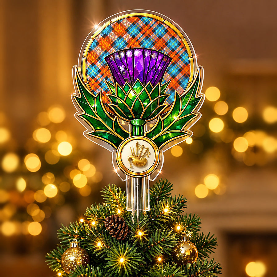 Stained-glass style thistle Christmas tree topper with a gold bagpipe emblem and the MacLachlan Ancient tartan behind the thistle