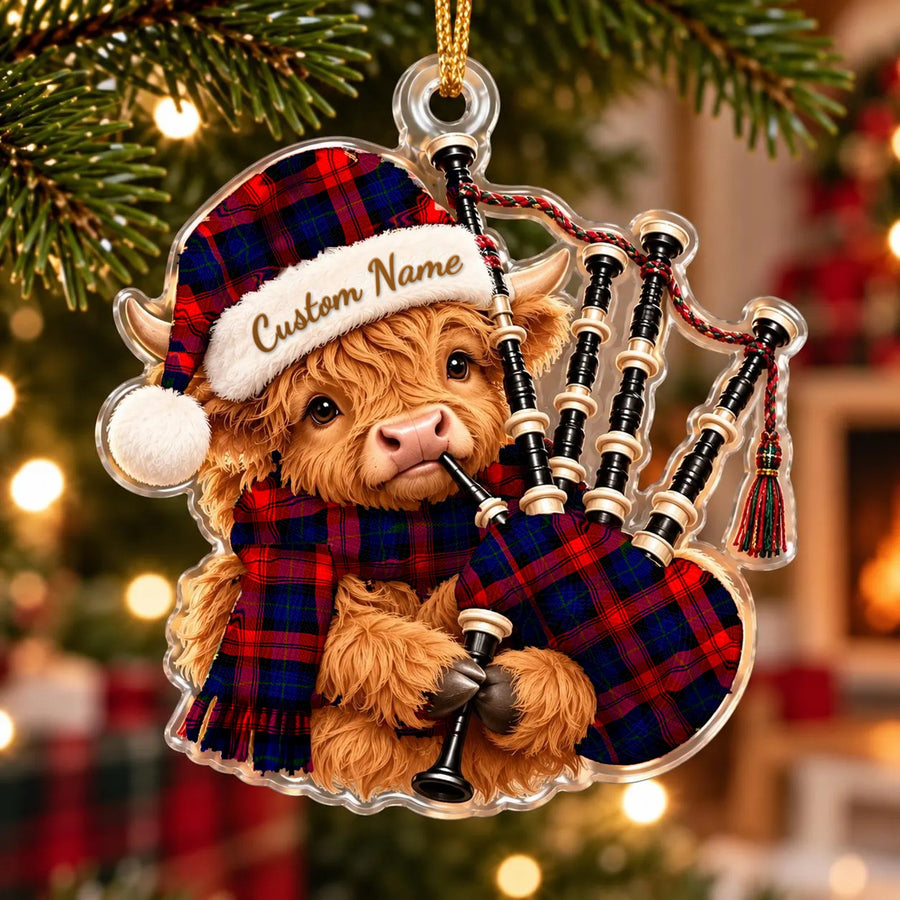 Acrylic Highland cow calf ornament playing the bagpipes, in a MacLachlan Modern tartan Santa hat, scarf and pipe bag, with a custom name on the hat