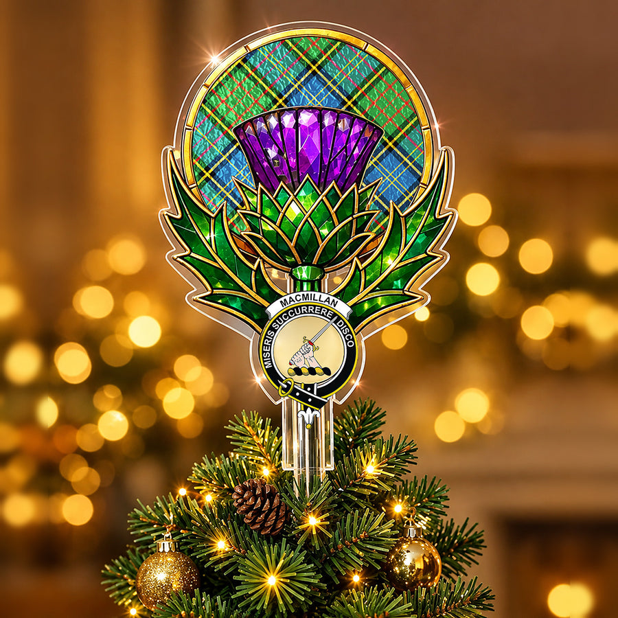 Clan MacMillan crest in the centre of a stained-glass style thistle Christmas tree topper with the MacMillan Hunting Ancient tartan behind the thistle