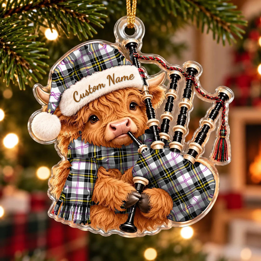 Acrylic Highland cow calf ornament playing the bagpipes, in a MacPherson Dress Modern tartan Santa hat, scarf and pipe bag, with a custom name on the hat