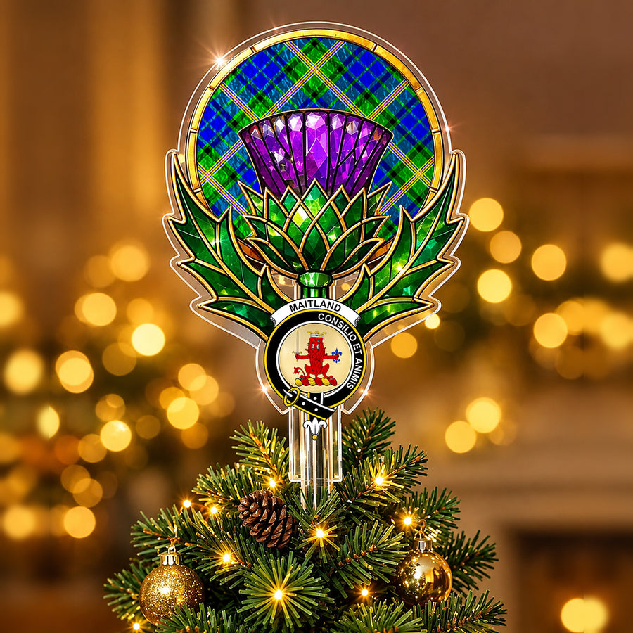 Clan Maitland crest in the centre of a stained-glass style thistle Christmas tree topper with the Maitland tartan behind the thistle