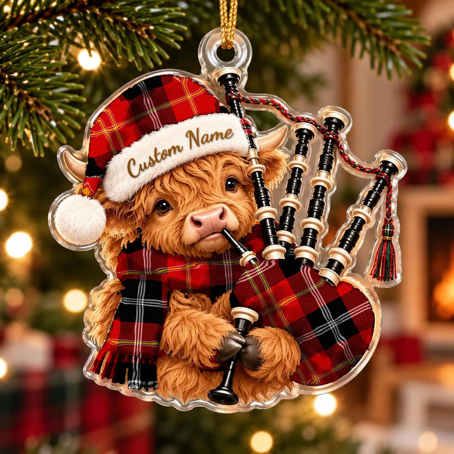 Acrylic Highland cow calf ornament playing the bagpipes, in a Marjoribanks tartan Santa hat, scarf and pipe bag, with a custom name on the hat