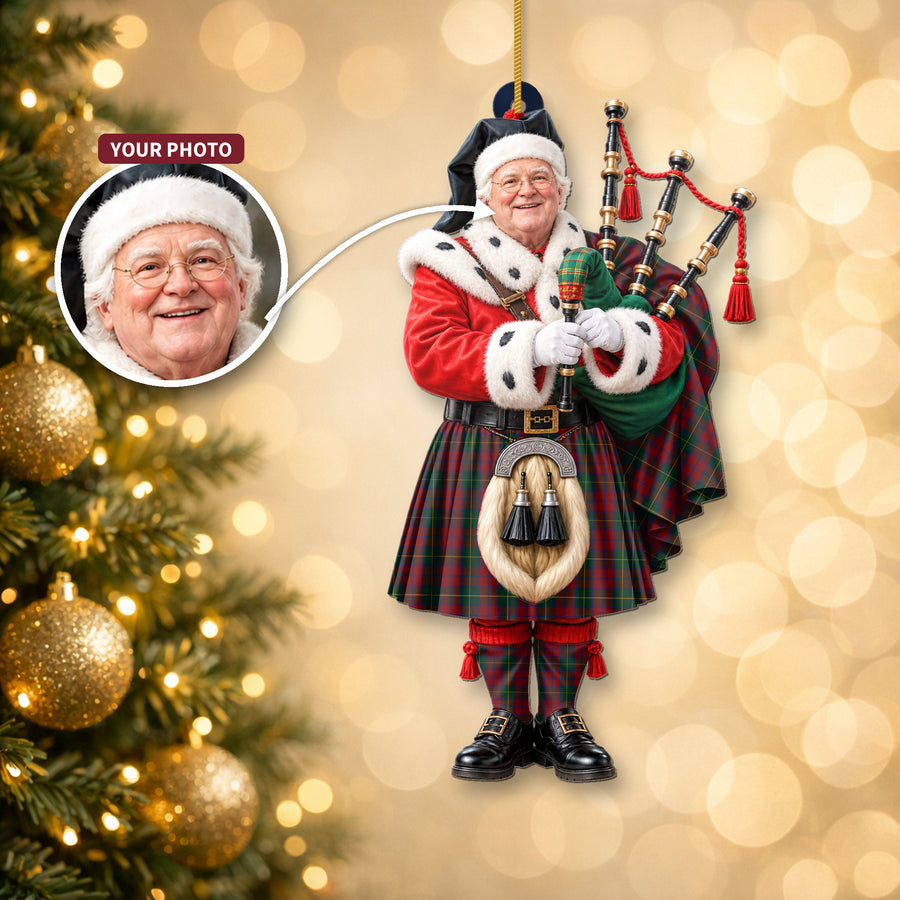 Christmas piper ornament in the McCarthy tartan hanging on a Christmas tree, with the customer photo used for the face