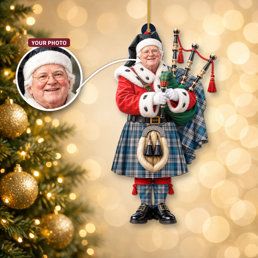Christmas piper ornament in the Napier Modern tartan hanging on a Christmas tree, with the customer photo used for the face