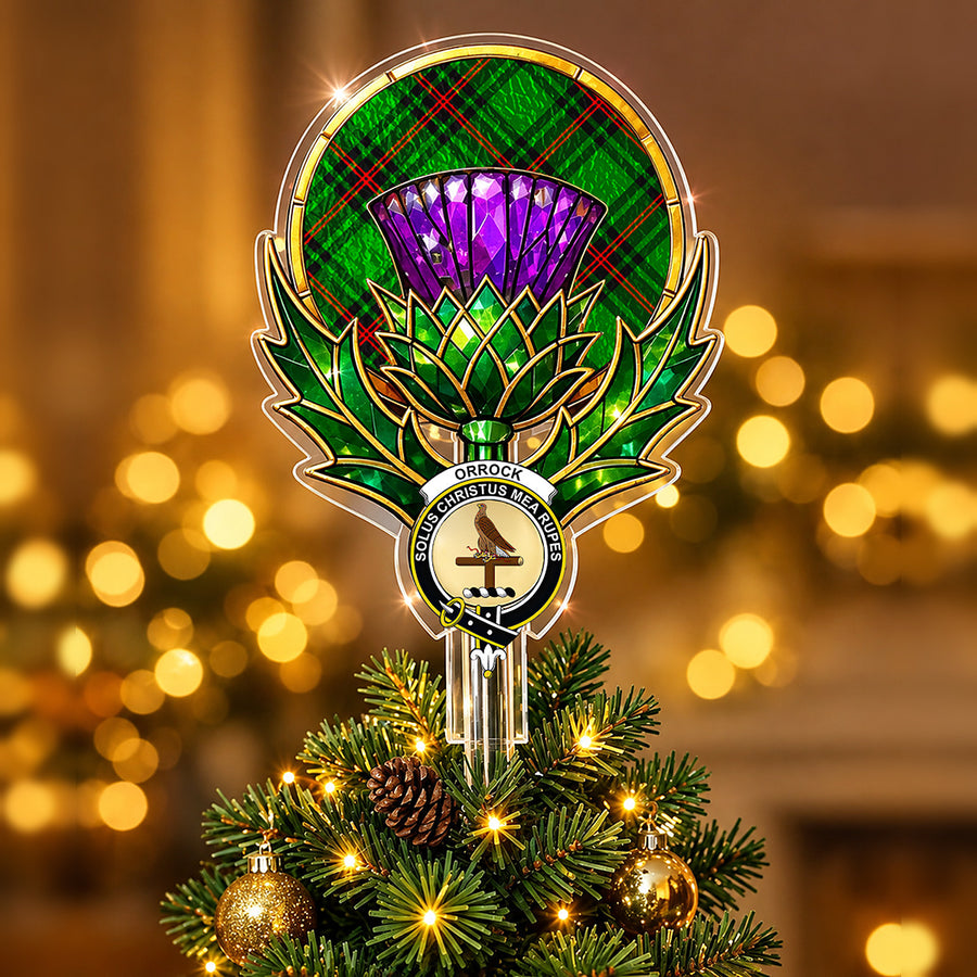 Clan Orrock crest in the centre of a stained-glass style thistle Christmas tree topper with the Orrock (Fife) tartan behind the thistle