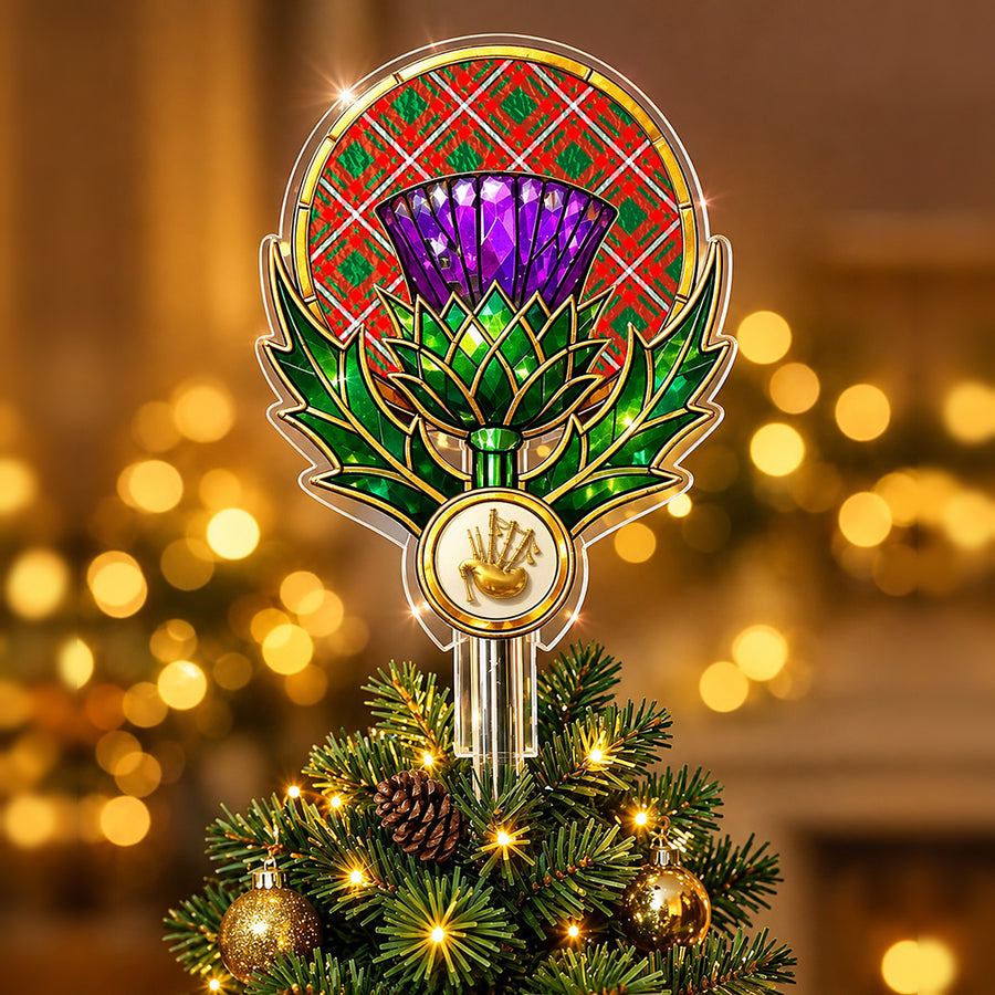 Stained-glass style thistle Christmas tree topper with a gold bagpipe emblem and the Princess Margaret tartan behind the thistle