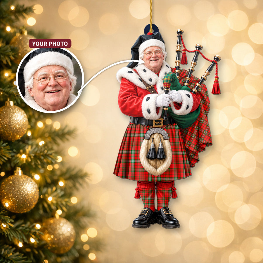 Christmas piper ornament in the Scott Modern tartan hanging on a Christmas tree, with the customer photo used for the face