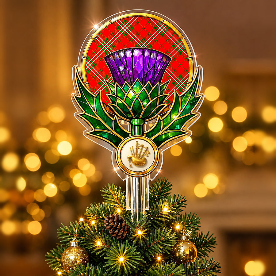 Stained-glass style thistle Christmas tree topper with a gold bagpipe emblem and the Scott Modern tartan behind the thistle