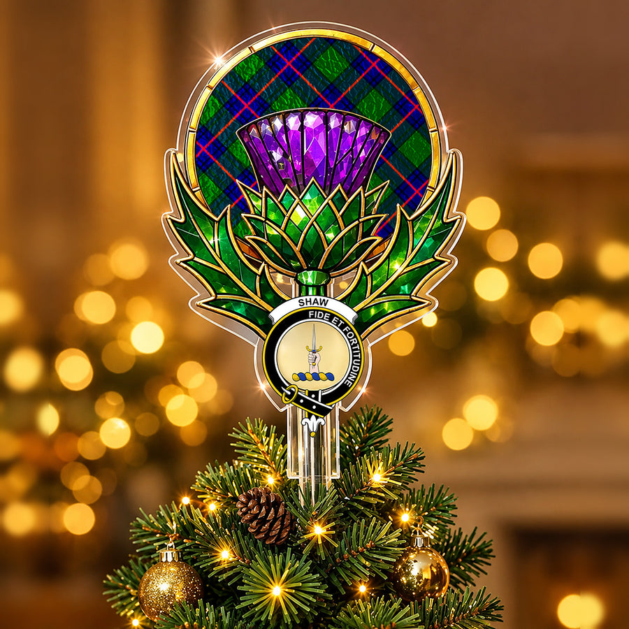 Clan Shaw crest in the centre of a stained-glass style thistle Christmas tree topper with the Shaw Modern tartan behind the thistle