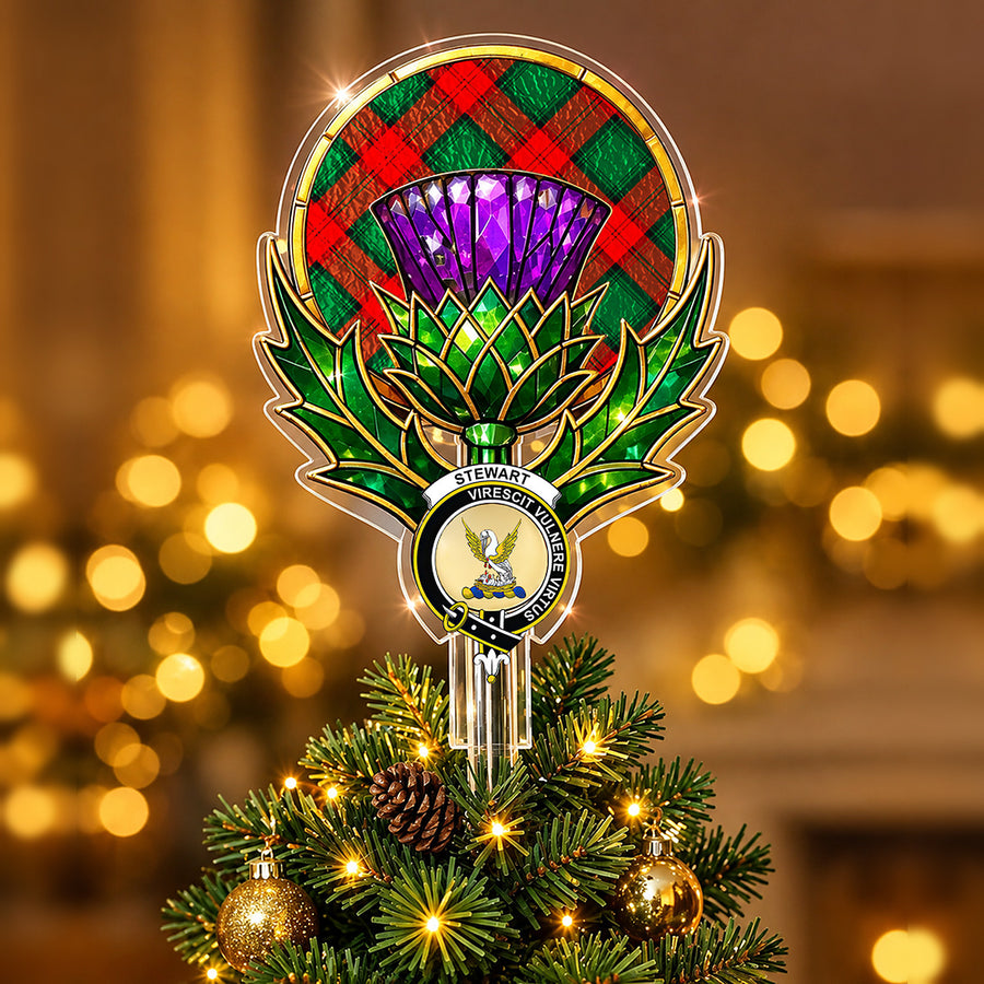 Clan Stewart crest in the centre of a stained-glass style thistle Christmas tree topper with the Stewart Atholl Modern tartan behind the thistle