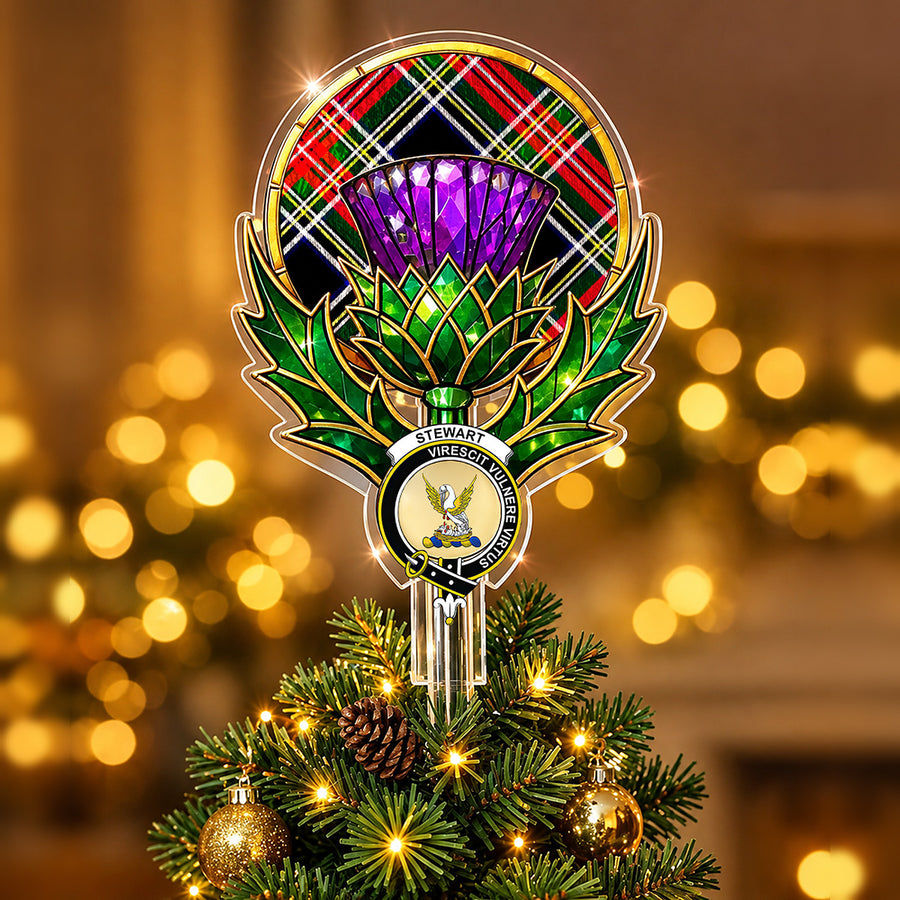 Clan Stewart crest in the centre of a stained-glass style thistle Christmas tree topper with the Stewart Black tartan behind the thistle