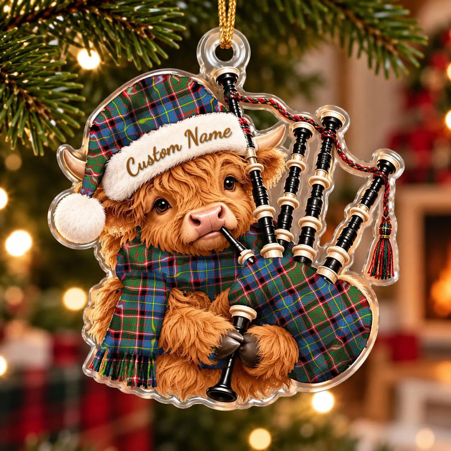 Acrylic Highland cow calf ornament playing the bagpipes, in a Stirling (of Cadder-Present Chief) tartan Santa hat, scarf and pipe bag, with a custom name on the hat