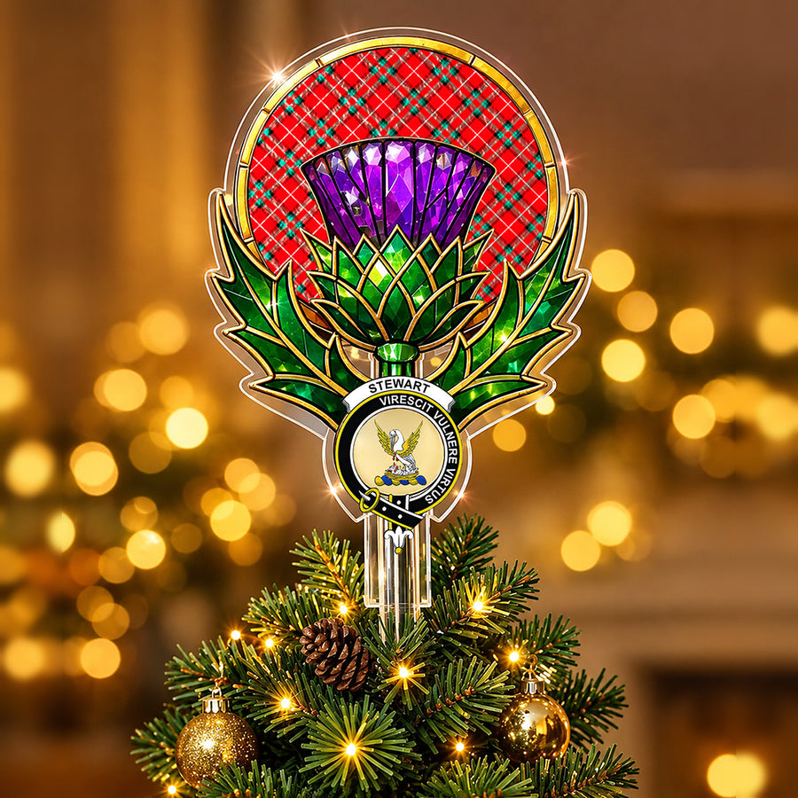 Clan Stewart crest in the centre of a stained-glass style thistle Christmas tree topper with the Stuart of Bute tartan behind the thistle