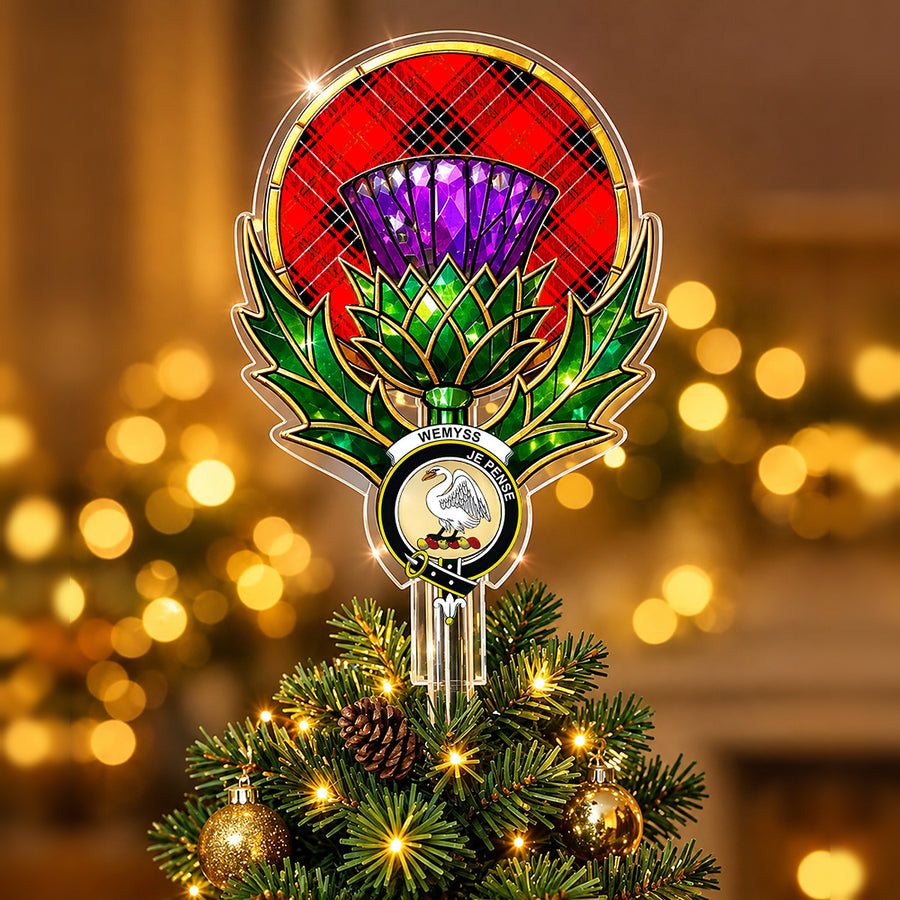 Clan Wemyss crest in the centre of a stained-glass style thistle Christmas tree topper with the Wemyss Modern tartan behind the thistle