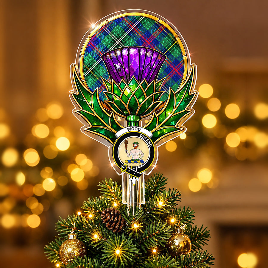 Clan Wood crest in the centre of a stained-glass style thistle Christmas tree topper with the Wood Modern tartan behind the thistle