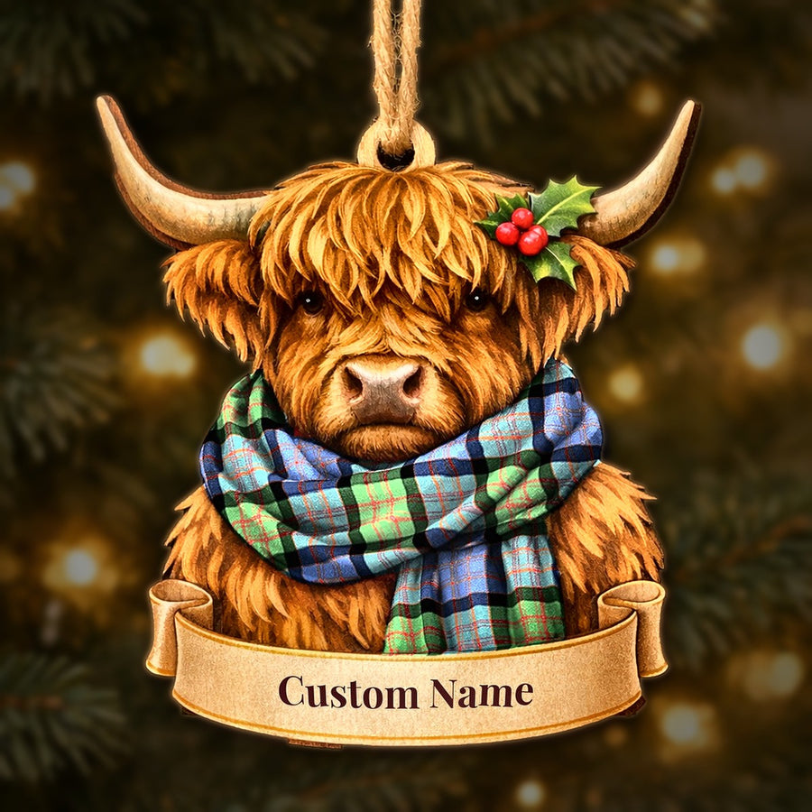 Wooden Highland cow Christmas ornament wearing a MacDonald Ancient tartan scarf, with a ribbon banner for a custom name