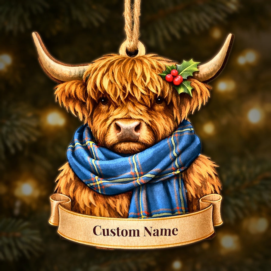 Wooden Highland cow Christmas ornament wearing a MacLaine of Loch Buie Hunting Ancient tartan scarf, with a ribbon banner for a custom name