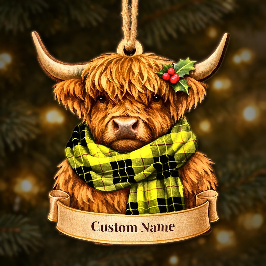 Wooden Highland cow Christmas ornament wearing a MacLeod of Lewis Modern tartan scarf, with a ribbon banner for a custom name