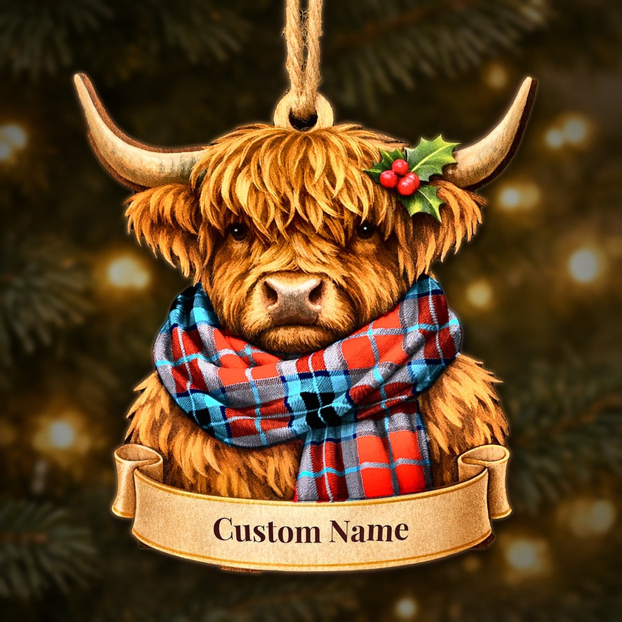 Wooden Highland cow Christmas ornament wearing a MacTavish Modern tartan scarf, with a ribbon banner for a custom name