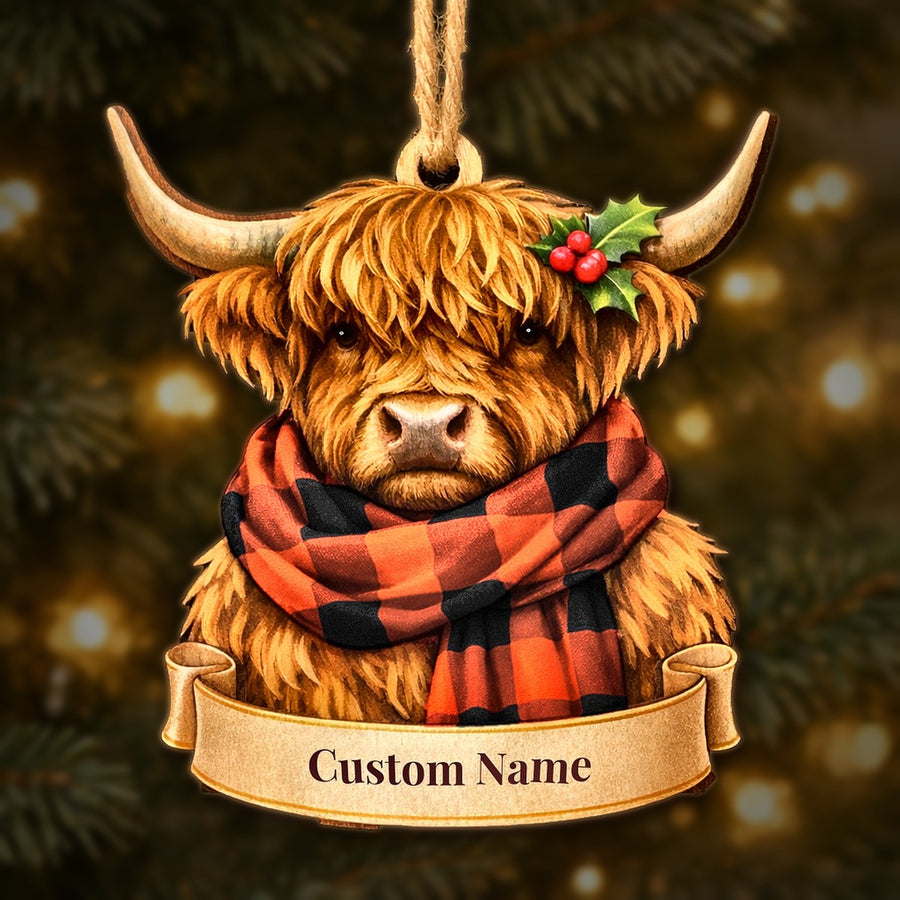 Wooden Highland cow Christmas ornament wearing a Rob Roy MacGregor Ancient tartan scarf, with a ribbon banner for a custom name