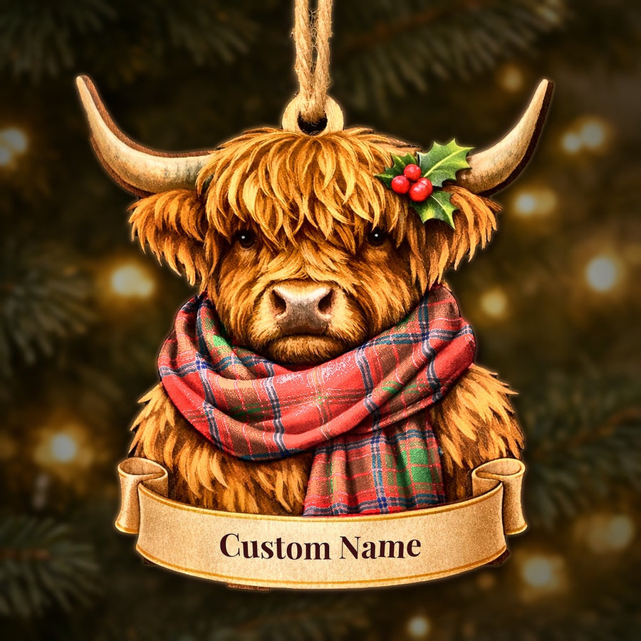 Wooden Highland cow Christmas ornament wearing a Ross Modern tartan scarf, with a ribbon banner for a custom name