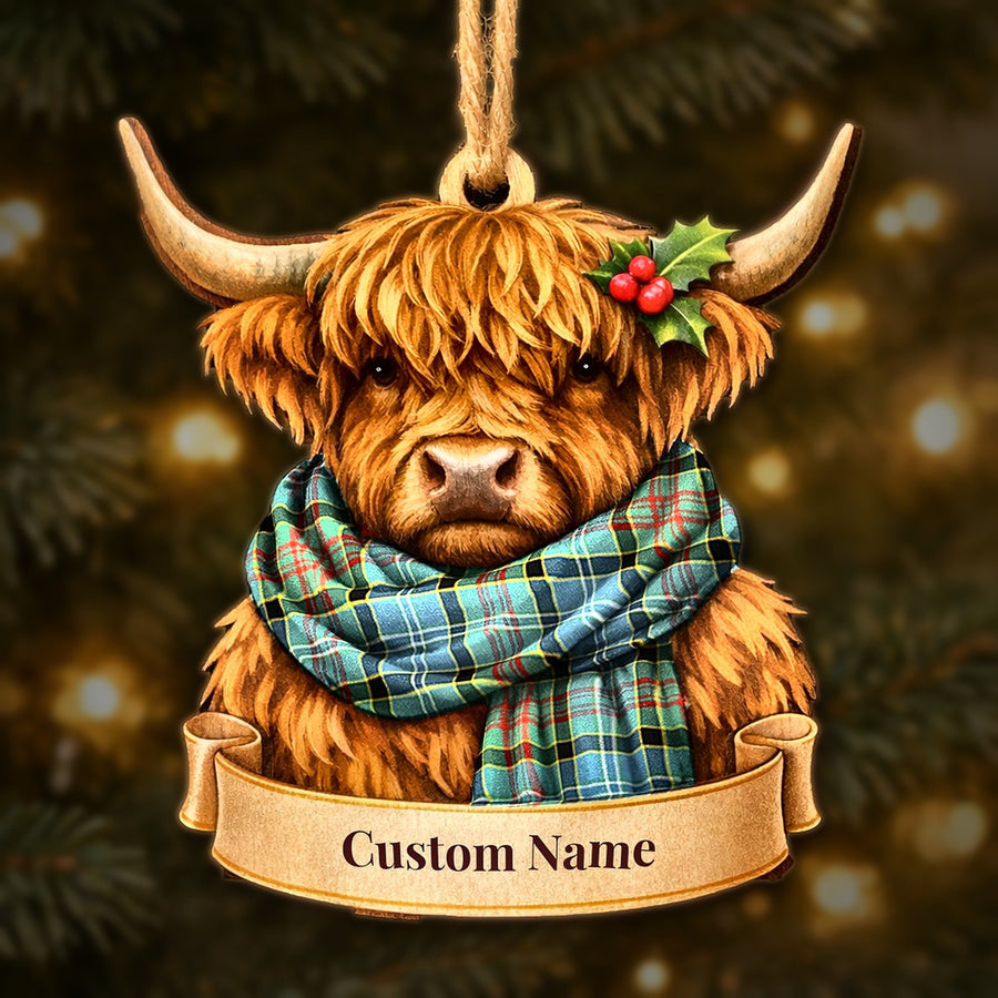 Wooden Highland cow Christmas ornament wearing a Walkinshaw tartan scarf, with a ribbon banner for a custom name