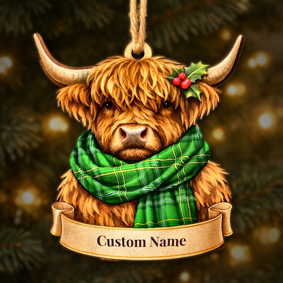Wooden Highland cow Christmas ornament wearing a Wexford County tartan scarf, with a ribbon banner for a custom name