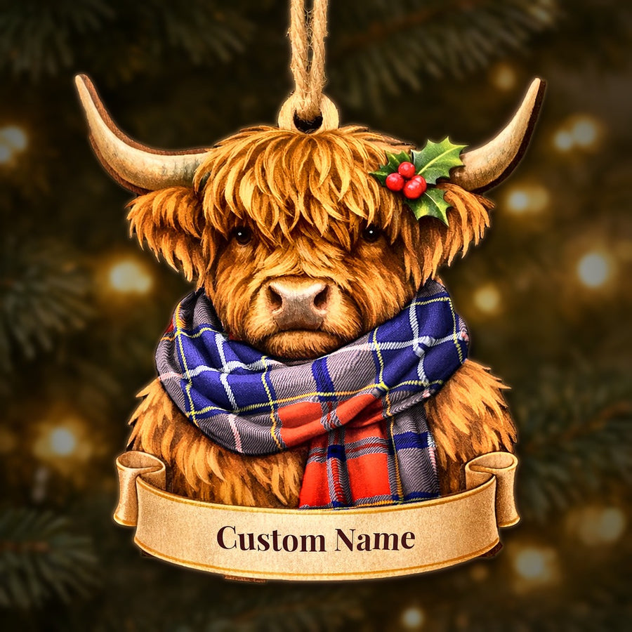 Wooden Highland cow Christmas ornament wearing a Wishart Dress tartan scarf, with a ribbon banner for a custom name