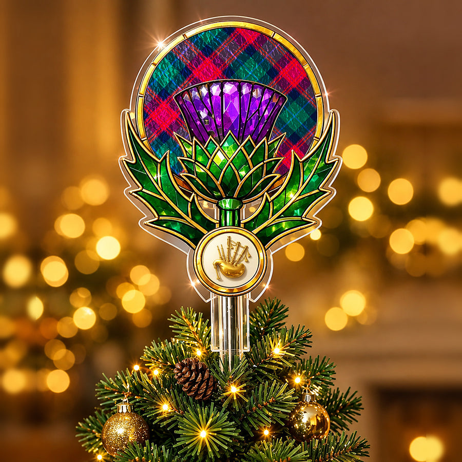 Stained-glass style thistle Christmas tree topper with a gold bagpipe emblem and the Akins tartan behind the thistle