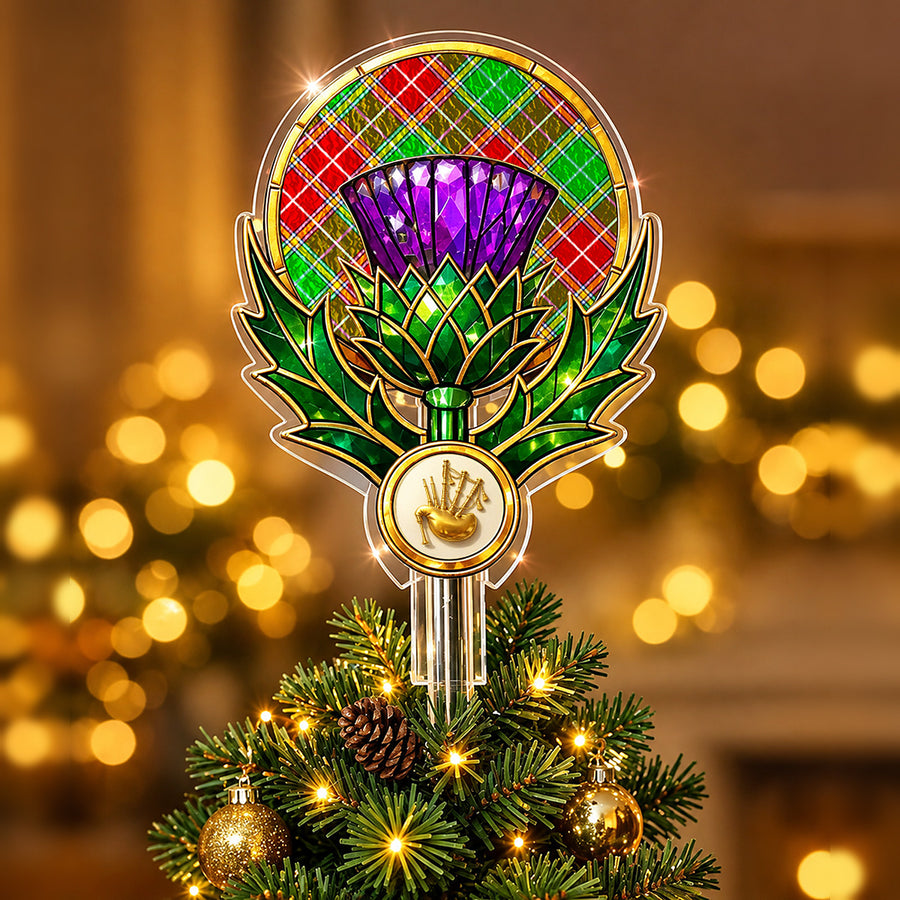 Stained-glass style thistle Christmas tree topper with a gold bagpipe emblem and the Baxter Modern tartan behind the thistle